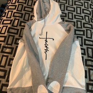 Gray and white “faith” sweatshirt.